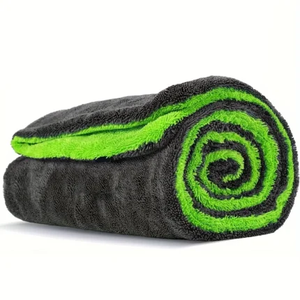 Rolled grey and green microfibre car drying towel