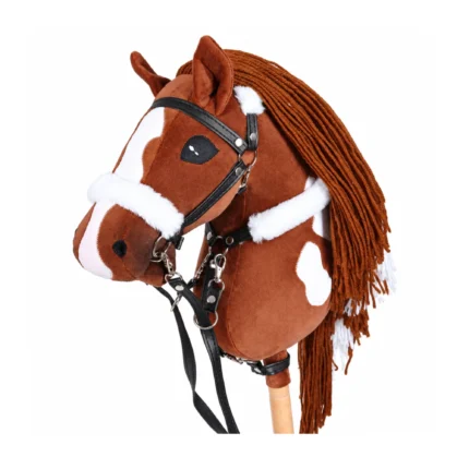 Chestnut paint stick horse with white blaze and black bridle with white fleece